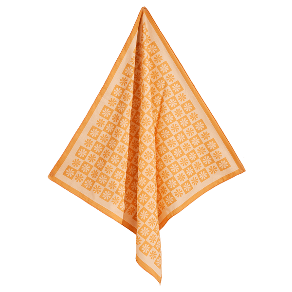 A bold, colourful, printed bandana in orange with an abstract floral pattern.