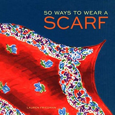 A dark blue book cover with an illustration of a red scarf with a floral pattern. The title reads: "50 ways to wear a scarf."