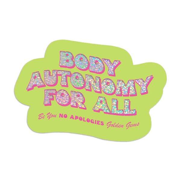 A green sticker with text in glitter and pink that reads "Body Autonomy For All."