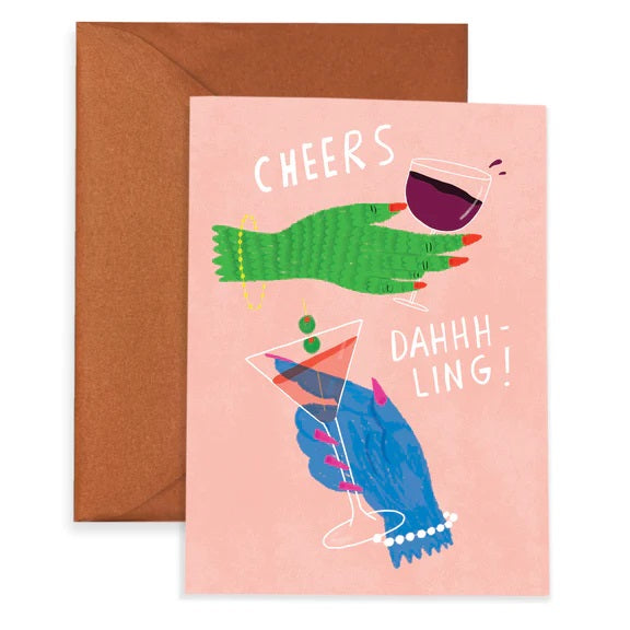 A pink greeting card with illustrations of two hands in blue and green and text reading "Cheers" and "Dahhh-ling!"