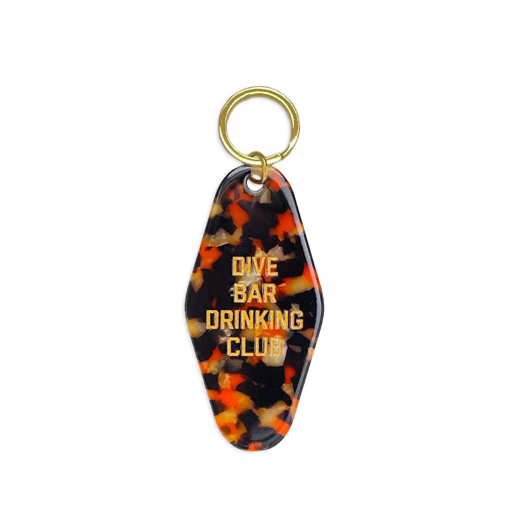 A keychain with the text "Dive Bar Drinking Club."