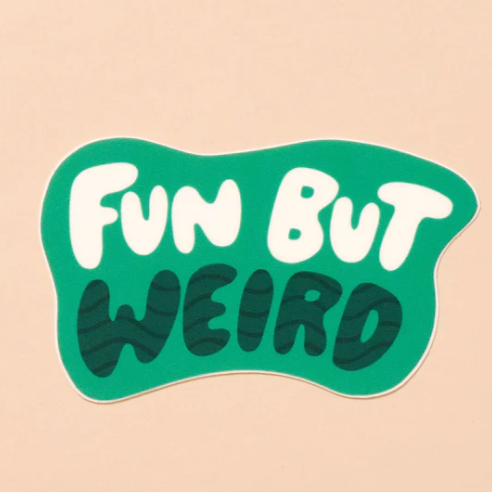 A peach background with a green sticker in front of it. The sticker is green with the words "Fun But Weird" written in bold letters. 