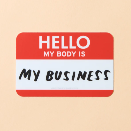 A beige background with a red sticker before it. The sticker is in the shape of a name tag with the words "Hello My Body is My Business."