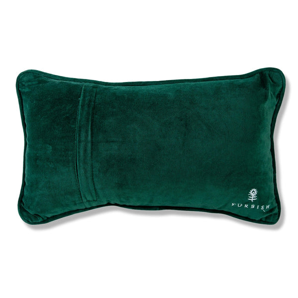 The back of a pillow with a green fabric.