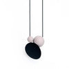 Long necklace with a statement pendant in the shape of three orbs in black and silver.