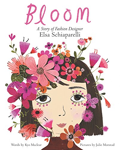 A white book cover with an illustration of a girl with a light skin tone and short brown hair. Her face is partly covered by pink flowers. The title reads "Bloom: A Story of Fashion Designer Elsa Schiaparelli."