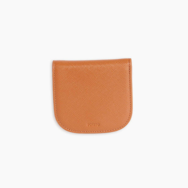 A tan vegan leather wallet before a white background.