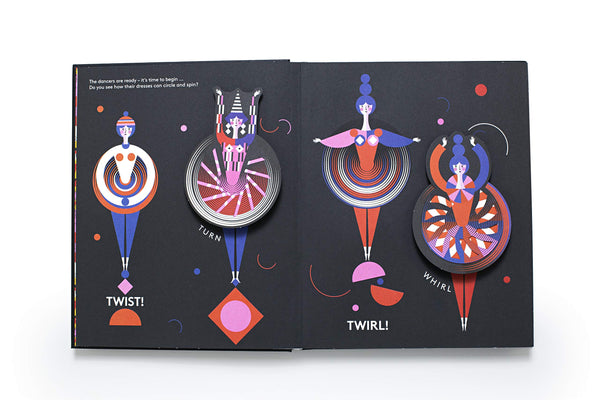 A look inside a book with illustrations and pop-up figurines of women dancing in colorful clothing.