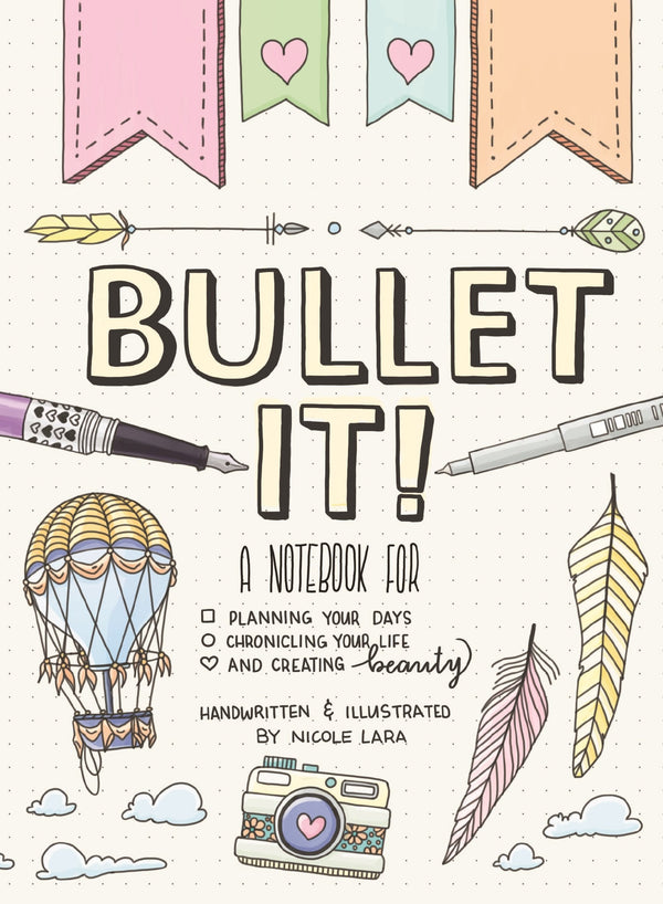 A white book cover with illustrations of pencils, a camera, and a hot air balloon. The title reads "Bullet It!: A Notebook for Planning Your Days, Chronicling Your Life, and Creating Beauty."