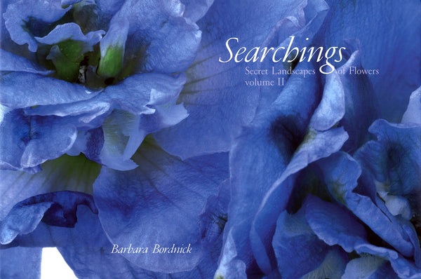A book cover with a close-up photograph of a blue flower. The title reads "Barbara Bordnick: Searchings: Secret Landscapes of Flowers, Vol. II."