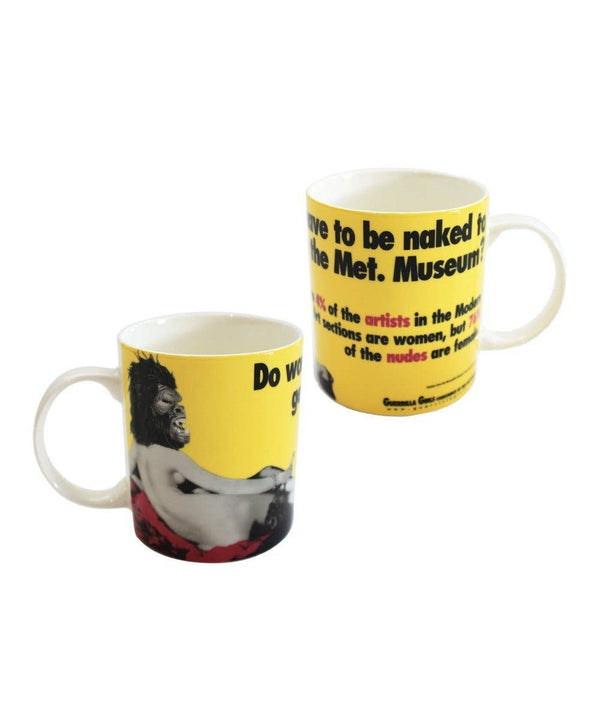 Two yellow mugs on a white surface. They have a naked woman in a gorilla mask printed on them, as well as the text "Do Women Have To Be Naked to get into the Met Museum?"