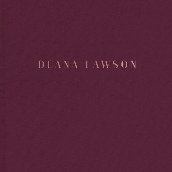 A red book with the words "Deana Lawson" in gold lettering. 