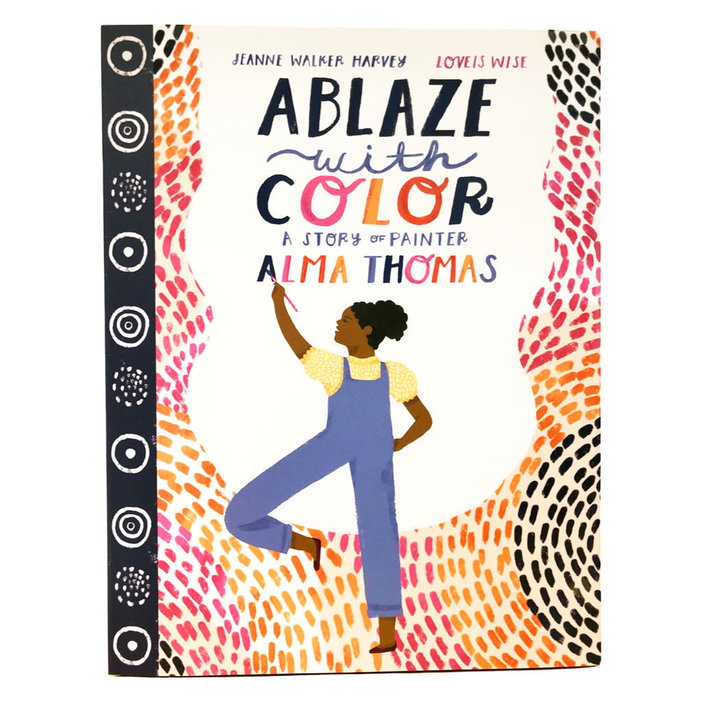 A colorful book cover depicting a woman with a dark skin tone painting the name "Alma Thomas." The title reads: "Ablaze with Color: A Story of Painter Alma Thomas."