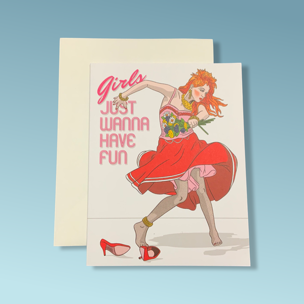 A greeting card with a woman dancing wearing a red dress and text reading "Girls just wanna have fun."