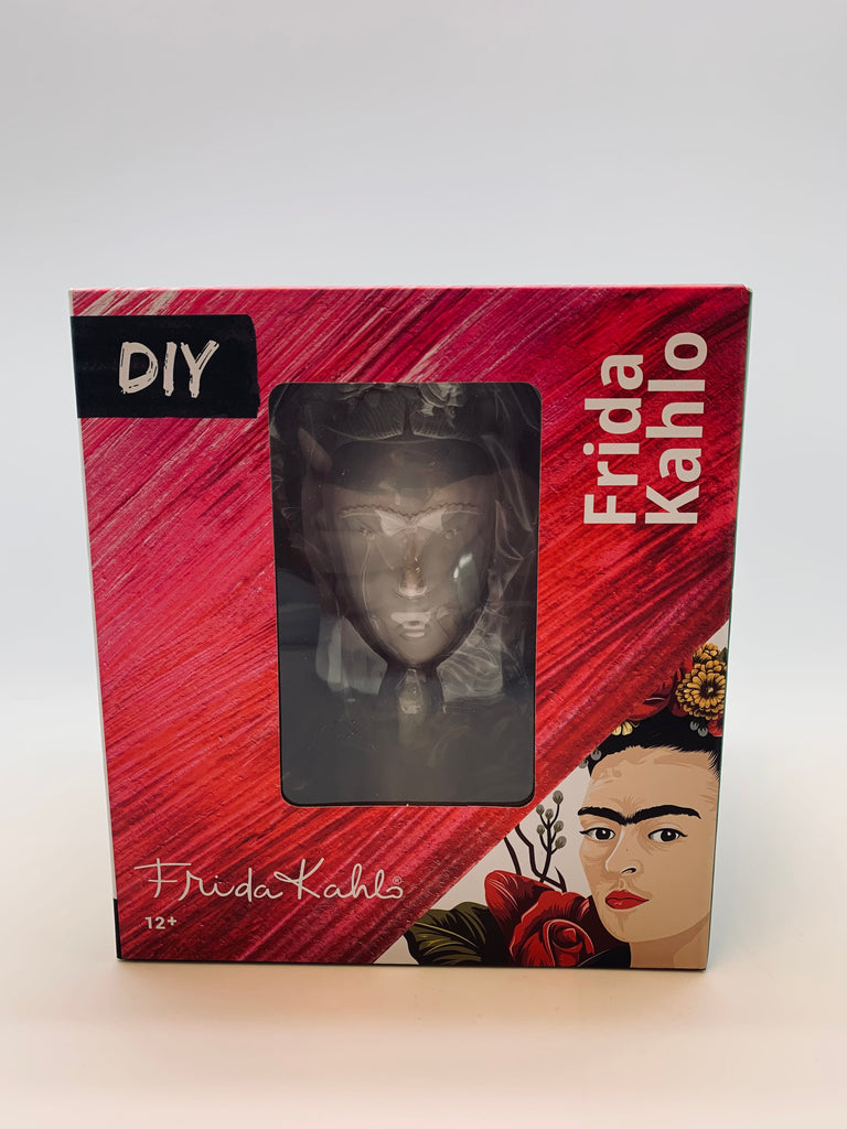 A box with a woman's face printed onto it. Through a window, you can see a figure of the same woman's face in a gray tone.