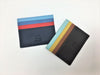 Two colorful leather credit card holders with four slots each.