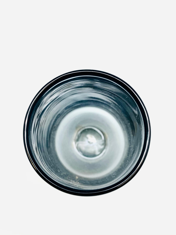 A photograph of a glass tumbler from above.