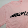 Close up of a pink t-shirt in front of a white background. On the t-shirt, text in black capital letters reads: "Can you name five women artists?"
