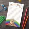 A notepad with a woman in front of a rainbow. The text above reads  "If you want the rainbow you gotta put up with the rain."