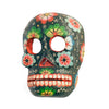 Hand-carved and hand-painted wooden mask of a skull in green with flowers painted on it.