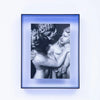 Print of a marble sculpture within a blue frame.