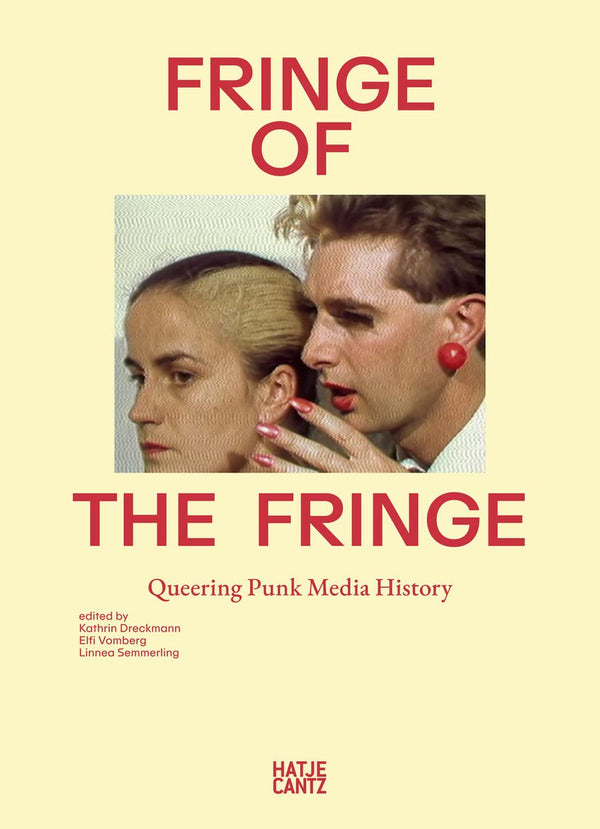 A pale yellow book with an image of a person with a light skin-tone and short, red hair whispering to another person with a light skin-tone and brown hair with a streak of white running through it. On the top of the image in red letters are the words "Fringe of." Below the image in red letters are the words "The Fringe." Below the bottom text are smaller words that say "Queering Punk Media History" in red. 