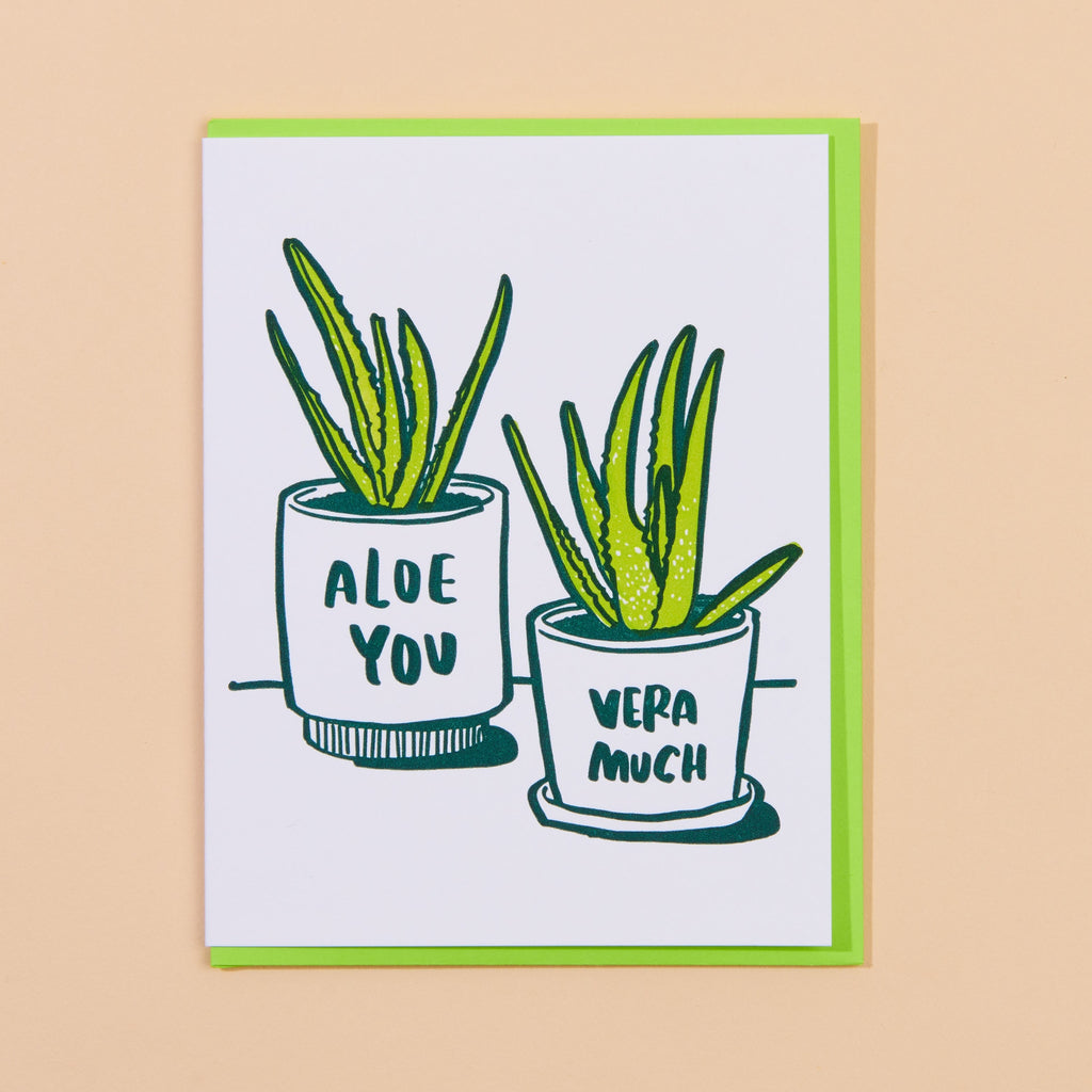 A greeting card with an illustration of two plant pots with the text: "Aloe Vera Very Much."