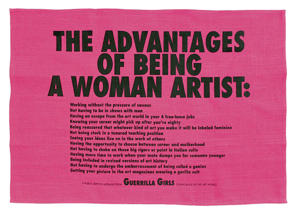 A pink tea towel with text that reads: "The Advantages of Being a Woman Artist." There is more detailed text underneath. 