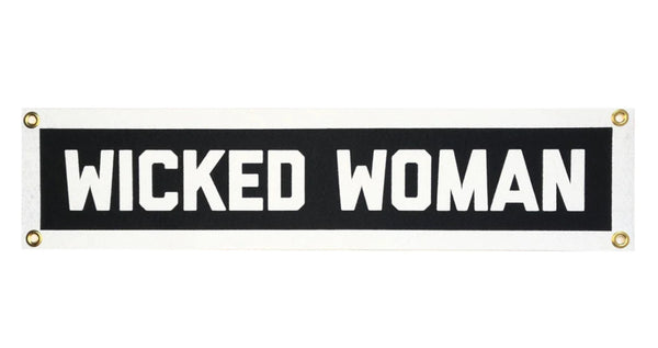 A white background with a black and white banner before it. The banner is black with a white border. The banner features the words "Wicked Woman" in white letters. 