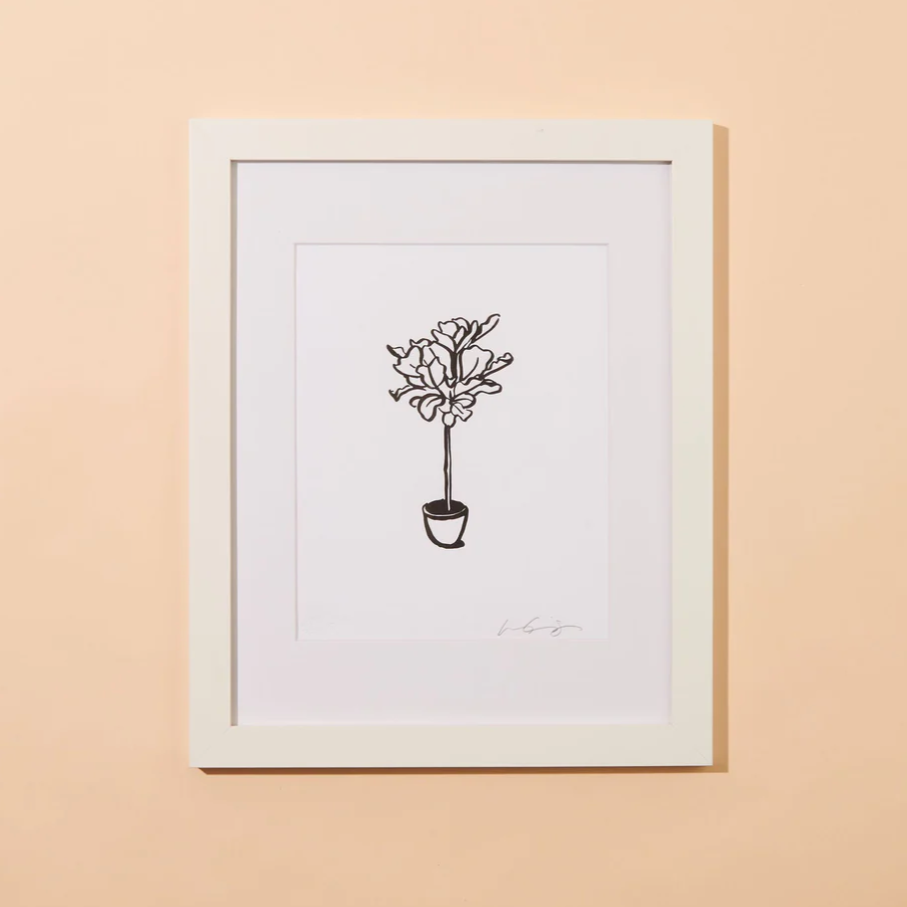 A peachy background with a white print before it. The print features an outline of a fiddle leaf. 