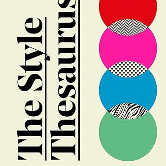 A cream book with rainbow spheres decorating the cover. The book is titled "The Style Thesaurus."