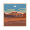A print of a desert landscape with a mountain range in the far back.