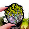 Sticker of a disco ball with plants on top.