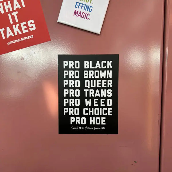 A pink locker with a black sticker before it. The sticker reads "Pro Black Pro Brown Pro Queer Pro Tans Pro Weed Pro Choice Pro Hoe."