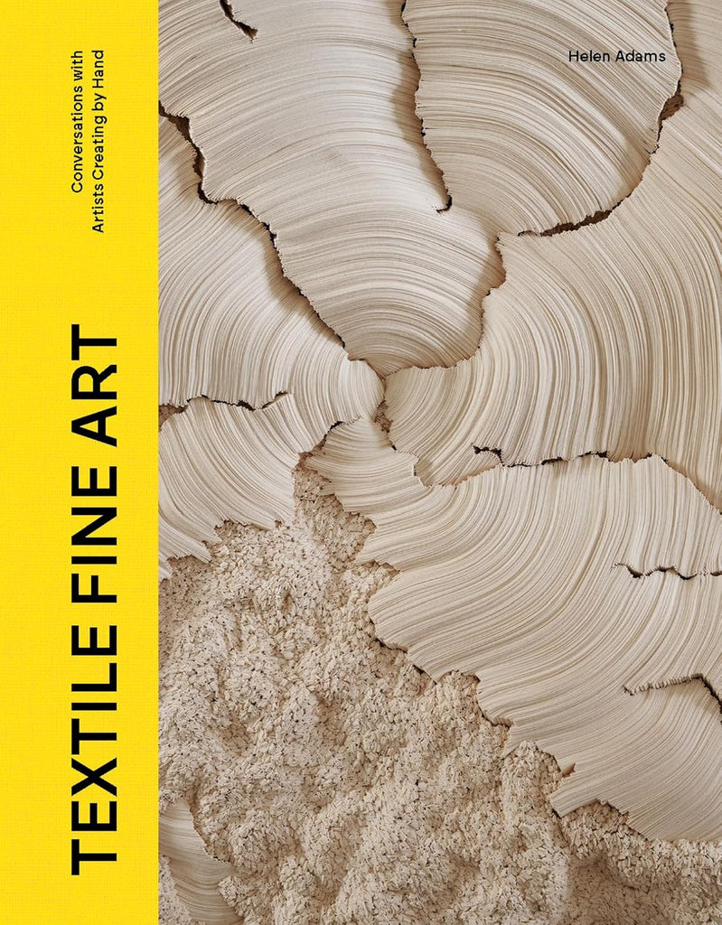 Book cover of 'Textile Fine Art' with a close-up of textured fabric and yellow spine.