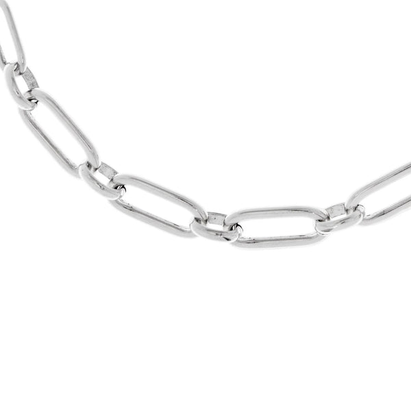 Close up of a rectangle-link chain necklace in silver.