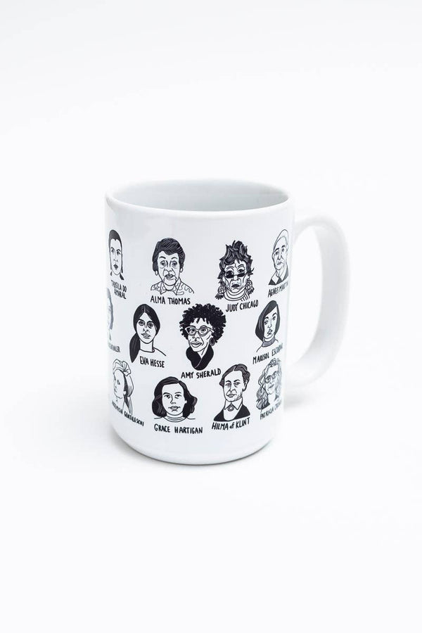 Ceramic mug with illustrations of women's faces, including "Amy Sherald" and "Alma Thomas."