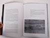 Look inside a book featuring text and a photograph.