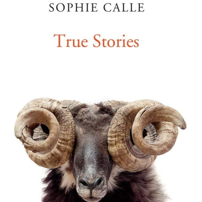 A white book with a ram on the cover. The book is titled "True Stories."