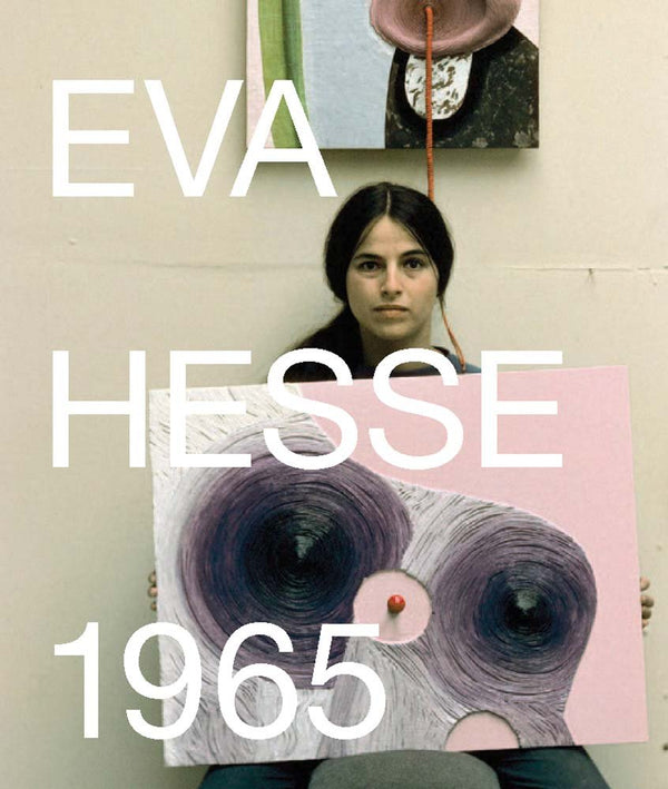 Book cover with a photograph of a woman sitting before a wall holding up an art piece. The title reads "Eva Hesse: 1965."