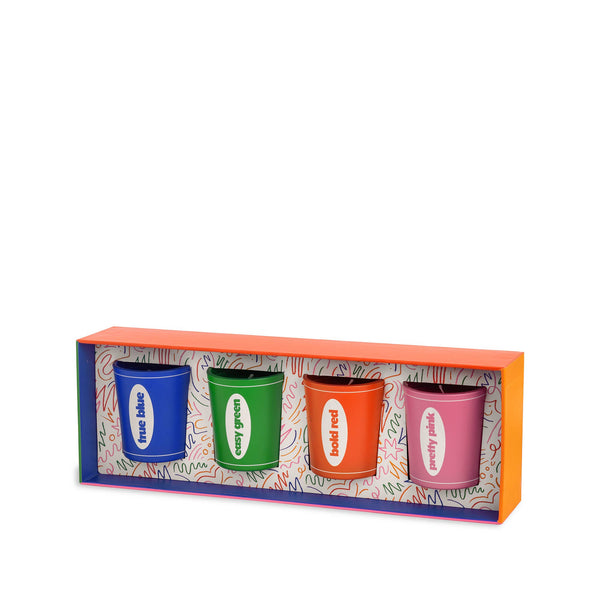 Four candles in bold colors in packaging. Each candle says its color, including "true blue", "cosy green", "bold red", and "pretty pink."