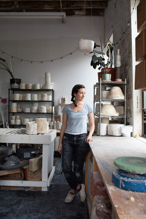 A photograph of a woman in her studio.