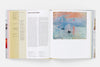 Look inside a book featuring text on the left and an Impressionist painting of  boats on a body of water at sunset on the right. 