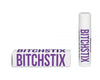White lipstick and a white box next to it. In purple letters, it says: "Bitchstix."