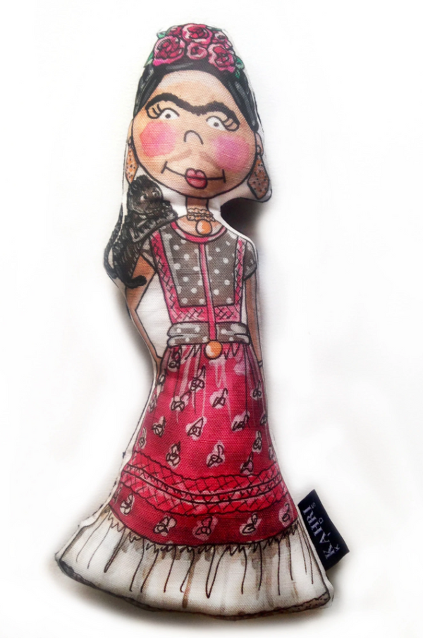 Textile doll of a woman in a colorful red dress with black hair and a flower crown on her head.