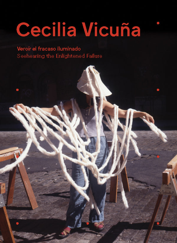 A book cover with a photograph of a woman holding big white threads over her whole body. The title reads "Cecilia Vicuña: Seehearing the Enlightened Failure."