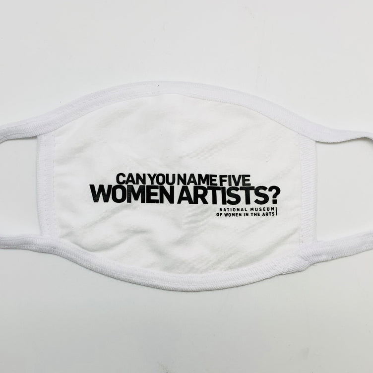A white cotton covid mask with black letters that read "Can you name five women artists?"