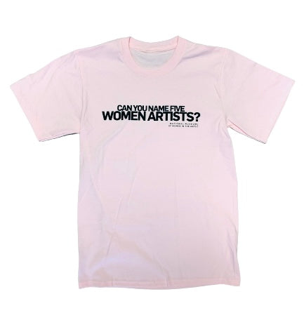 A pink t-shirt in front of a white background. On the t-shirt, text in black capital letters reads: "Can you name five women artists?"