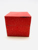 Red note cube with sticky notes with a dot pattern all over. 