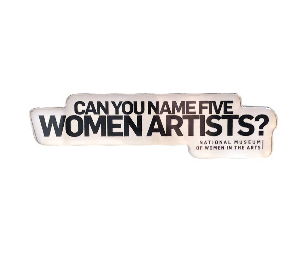 A magnet with black text that reads "Can you name five women artists?"